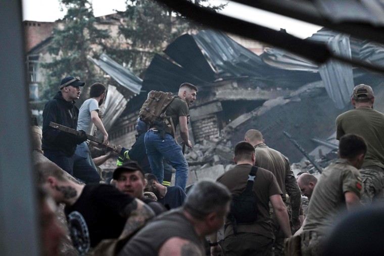 A Russian missile attack that hit a crowded pizza restaurant in an eastern Ukrainian city killed at least nine people, including three children, authorities said Wednesday, as rescue workers continued searching in the destroyed building’s rubble.