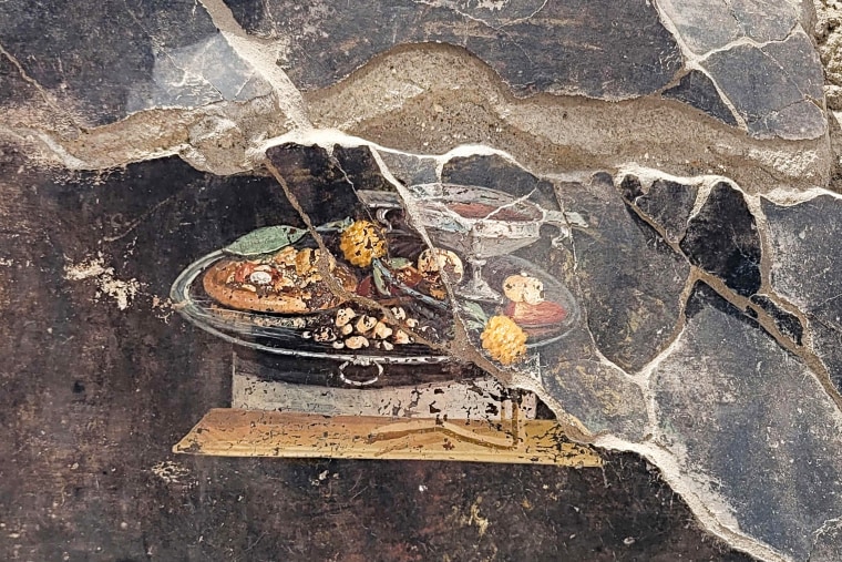 A 2,000-year-old fresco that appears to show a distant ancestor of pizza was discovered on the wall of ancient Pompeiian house.