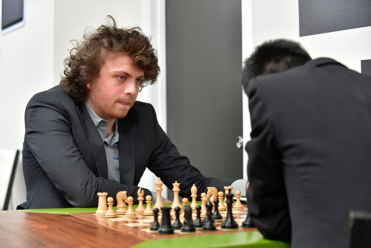 US international grandmaster Hans Niemann waits his turn to move during a second-round chess game against Jeffery Xiong on the second day of the Saint Louis Chess Club Fall Chess Classic in St. Louis, Missouri, on October 6, 2022. - Niemann said on October 5 that he "won't back down," after the chess platform chess.com reported he has "probably cheated more than 100 times" in online games.