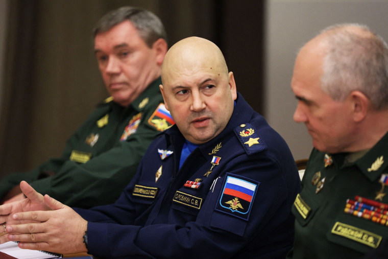 Sergei Surovikin attends a meeting with Russian President Vladimir Putin alongside top military officials