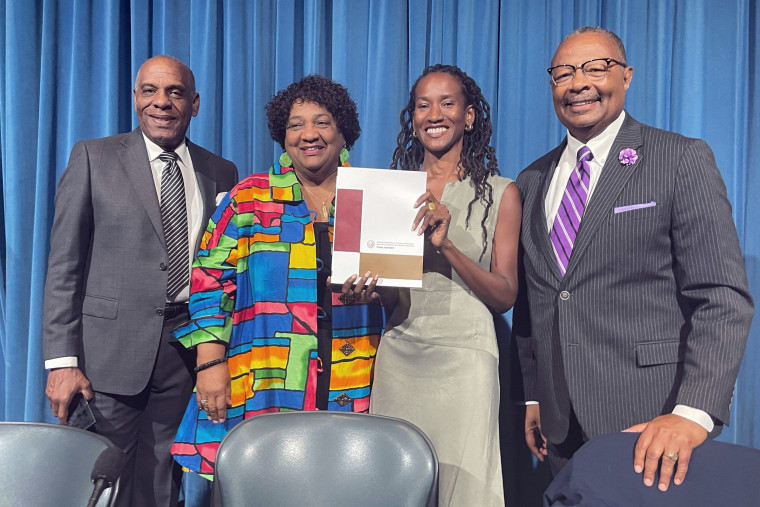 From left, State Sen. Steven Bradford, Secretary of State Shirley Weber, task force member Lisa Holder and Assemblymember Reggie Jones-Sawyer hold up a final report of the California Task Force to Study and Develop Reparation Proposals for African Americans during a hearing in Sacramento, Calif., Thursday, June 29, 2023. 