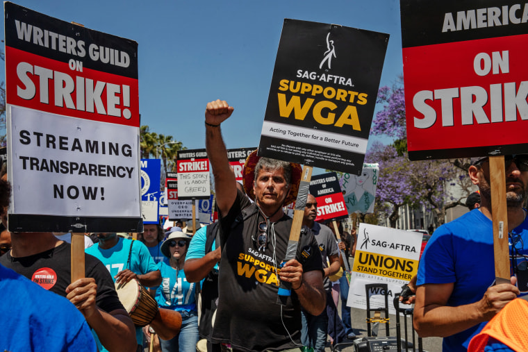 Members of SAG-AFTRA join striking members of the Writers Guild of America in Los Angeles on June 21, 2023. 
