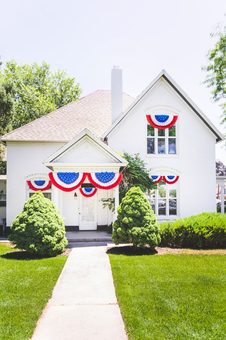red, white and blue bunting on house