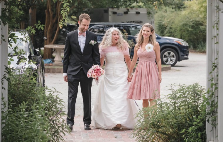 Dr. Van Morris, left, and Dr. Emma Holliday, right, of The University of Texas MD Anderson Cancer Center walked Shaw down the aisle at her wedding.
