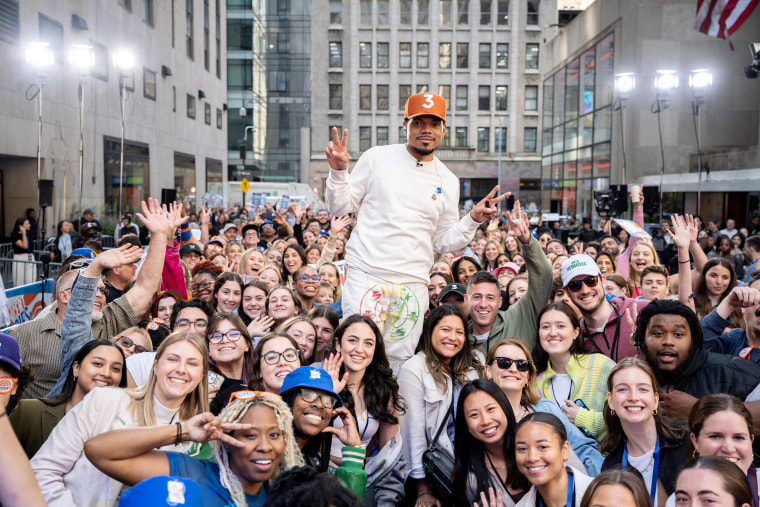Chance the rapper poses for a pic with a large smiling audience at Rockefeller Plaza during the Citi Concert Series on the TODAY show. 
