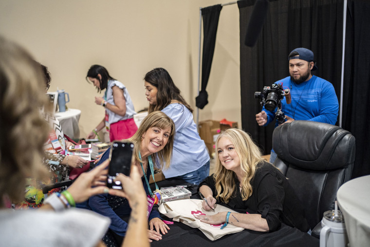 Colleen Hoover with a fan at Book Bonanza  on June 23, 2023 in Grapevine, TX. 