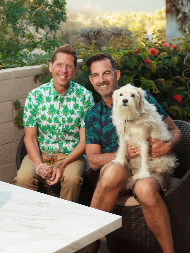 Wade Rouse with his husband and dog.