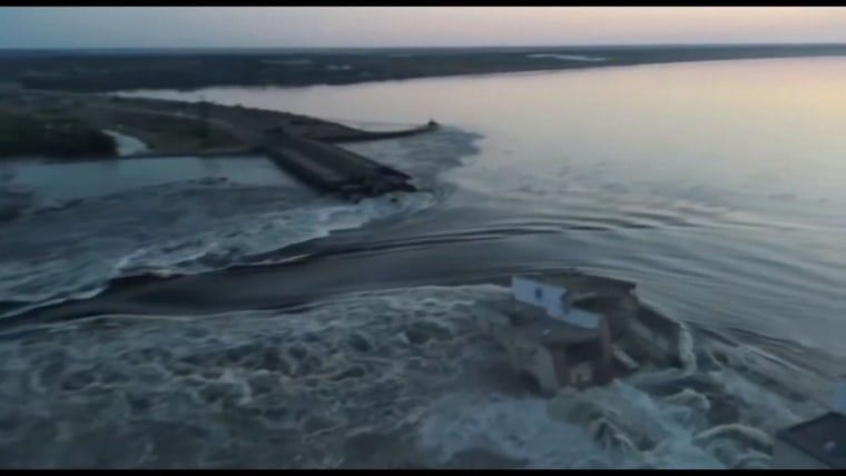 This image from a video posted on social media by Ukrainian President Volodymyr Zelenskyy shows water gushing through the destroyed Khakovka dam.