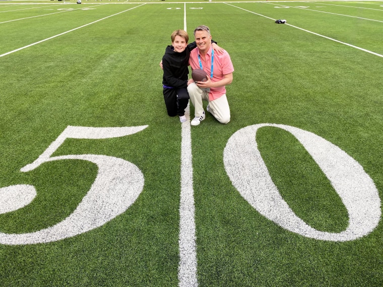 Bradley and Lucas on the 50-yard line at the Sofi Stadium in Los Angeles, where Super Bowl 2022 was played.
