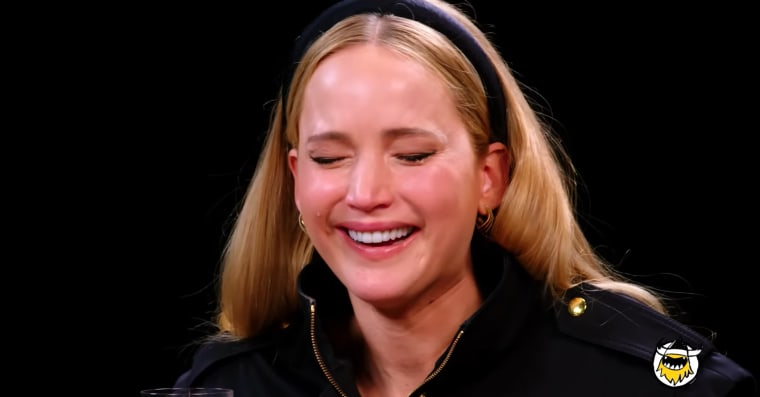 Jennifer Lawrence laughs as a tear rolls down her cheek during her "Hot Ones" appearance.
