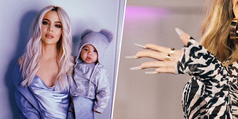 Khole Kardashian holding her baby with long nails