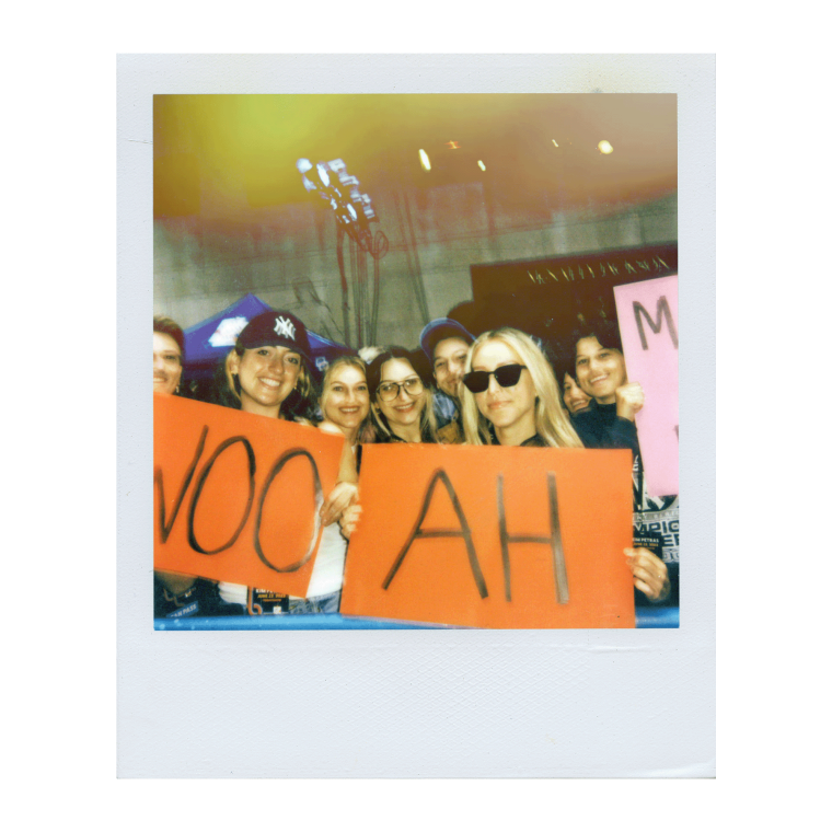 Polaroid of two fans with their “Woo” and “Ah” signs at Rockefeller Plaza during the Citi Concert Series on the TODAY show.