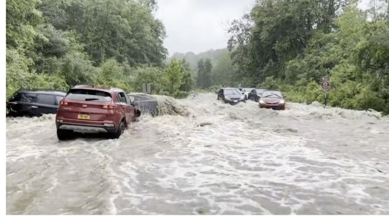 Cars left stranded by flooding near Woodbury and Harriman in Orange County, N.Y.