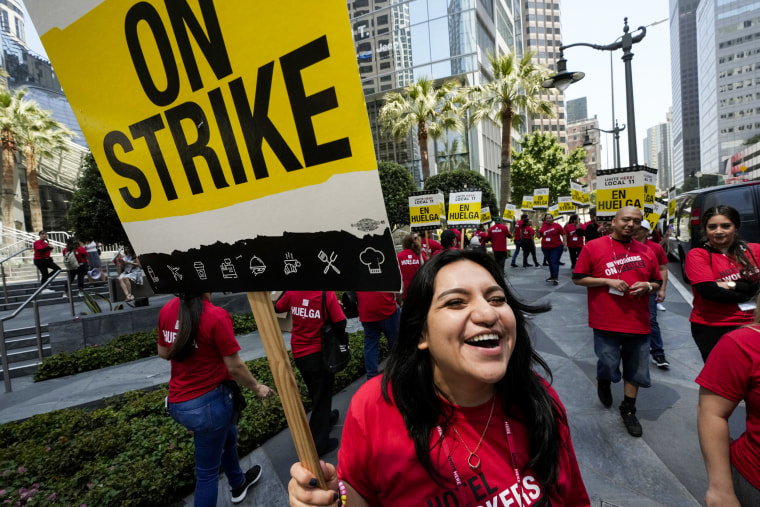 Striking hotel workers rally outside the Intercontinental Hotel after walking off their job in Los Angeles on July 2, 2023.
