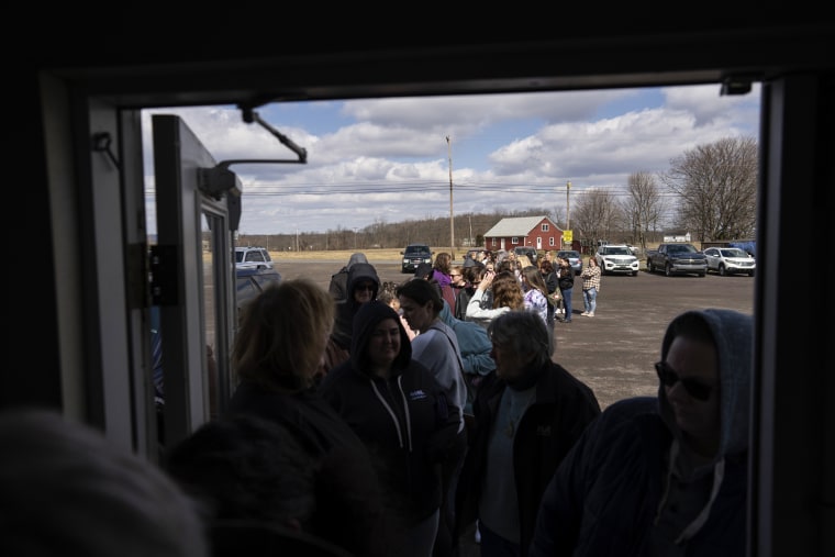 Ticket holders line up before the doors open for the sold-out "Drag Bingo" fundraiser at the Nescopeck Township Volunteer Fire Company Social Hall, in Nescopeck, Pa., on March 18, 2023.