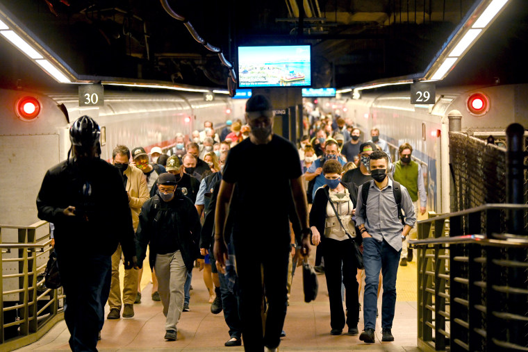 Commuters disembark from a Metro-North train, in New York City