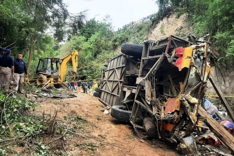 This handout picture released by the Tlaxiaco Municiapl Police shows the remains of a bus after it plummeted into a ravine in the outskirts of Magdalena PeÃ±asco, Oaxaca state, Mexico on July 5, 2023. At least 25 people were killed in Mexico when a passenger bus plummeted into a ravine Wednesday in the southern state of Oaxaca, police said. "The preliminary toll is 25 people dead and 17 seriously injured," a police officer told AFP by telephone, asking not to be identified because he was not authorized to speak to the media.
