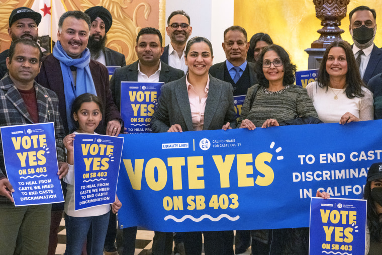 Aisha Wahab, center,  with supporters following a news conference where she proposed SB 403, in Sacramento, Calif.