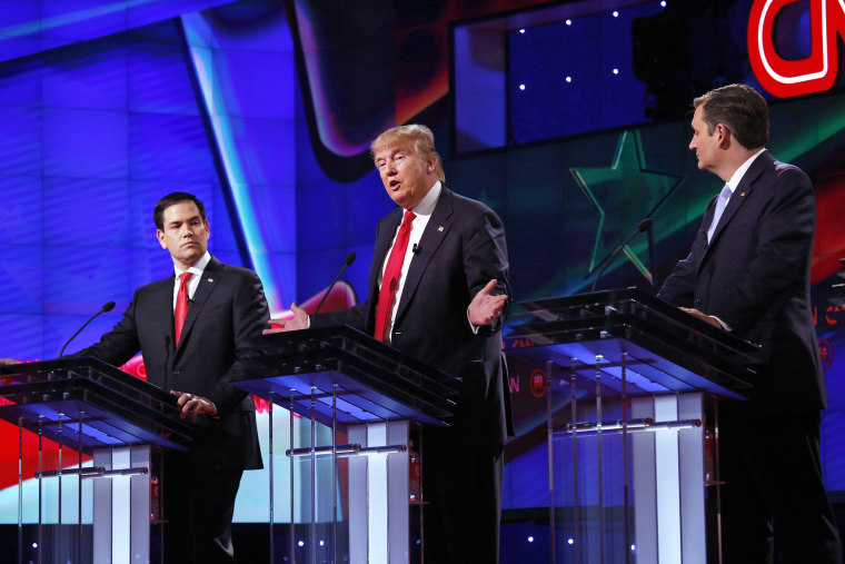 Donald Trump speaks during a Republican primary debate alongside Sen. Marco Rubio and Sen. Ted Cruz