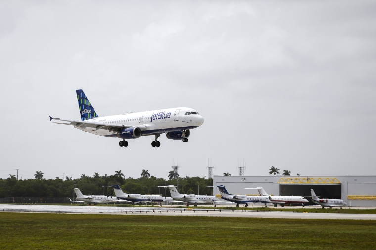 A JetBlue airplane lands at Fort Lauderdale-Hollywood International Airport
