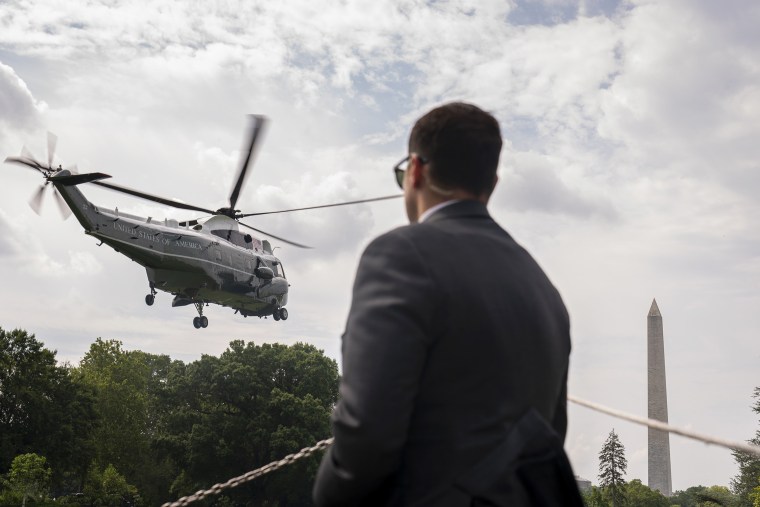 A Secret Service agent watches as Marine One with President Joe Biden abroad lifts off from the South Lawn of the White House in Washington, Thursday, July 6, 2023, for a short trip to Andrews Air Force Base, Md,. and then on to South Carolina.