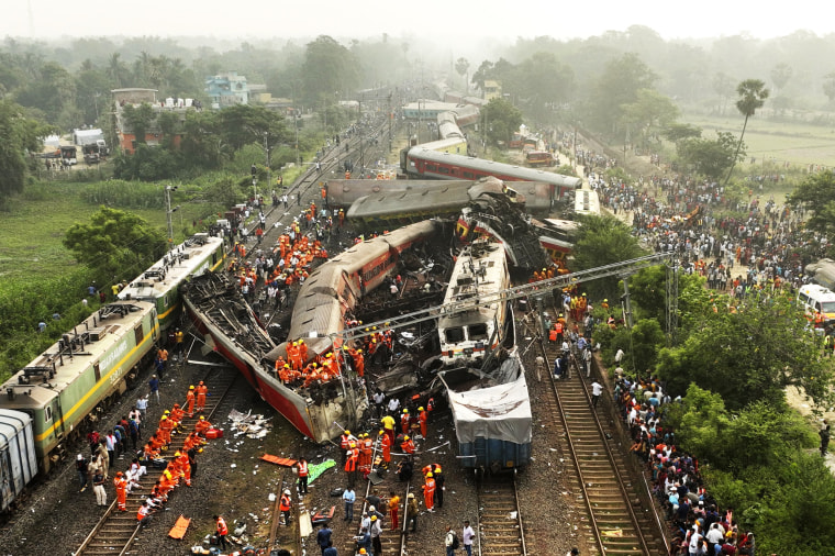 Rescuers work at the site of a fatal train accident in Orissa