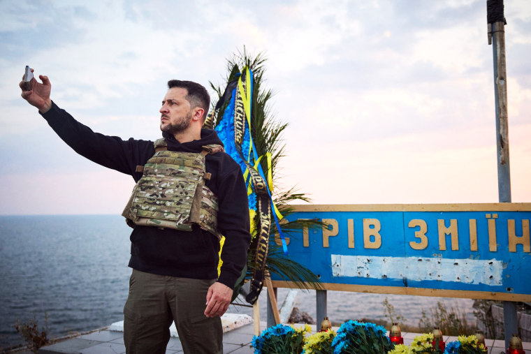 Ukrainian President Volodymyr Zelenskyy takes a selfie during his visit to Snake Island, Ukraine. 