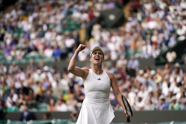 Elina Svitolina celebrates winning the women's singles match against Victoria Azarenka during the Wimbledon tennis championships in London