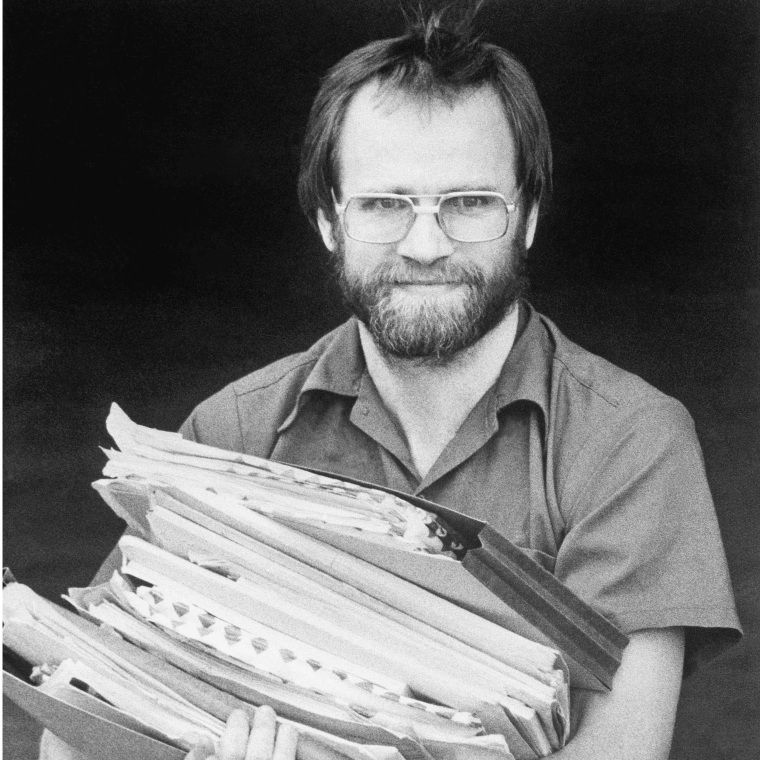 James W. Lewis holds documents at federal court in Kansas City, Mo., on June 5, 1984.