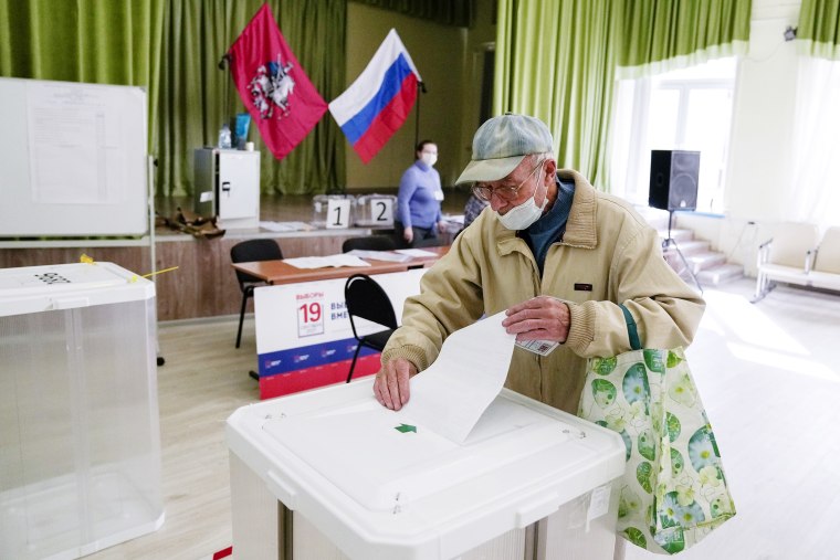 A man casts his ballot at a polling station during a parliamentary elections in Moscow, Russia, Saturday, Sept. 18, 2021. Sunday will be the last of three days voting for a new parliament that is unlikely to change the country's political complexion. There's no expectation that United Russia, the party devoted to President Vladimir Putin, will lose its dominance in the State Duma.