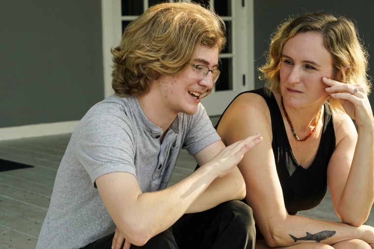 Ray Walker, 17, left, and his mother Katie Rives, discuss his moving to Virginia for continued gender-affirming care on June 28, 2023, in Madison County, Miss.
