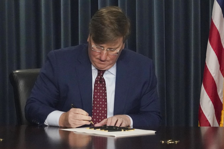 Mississippi Republican Gov. Tate Reeves signs Mississippi House Bill 1125 to ban gender-affirming care in the state for anyone younger than 18 on Feb. 28, 2023, in Jackson.
