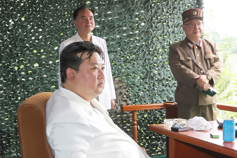 This picture taken on July 12, 2023 and released from North Korea's official Korean Central News Agency (KCNA) on July 13, 2023 shows North Korea's leader Kim Jong Un (front L) attending the test firing of a new intercontinental ballistic missile (ICBM) 