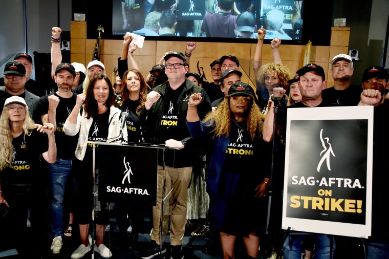 US actress Frances Fisher, SAG-AFTRA secretary-treasurer US actress Joely Fisher, SAG-AFTRA President US actress Fran Drescher, and National Executive Director and Chief Negotiator Duncan Crabtree-Ireland, joined by SAG-AFTRA members, pose for a photo during a press conference at the labor union's headquarters in Los Angeles, California, on July 13, 2023. Tens of thousands of Hollywood actors will go on strike at midnight Thursday, effectively bringing the giant movie and television business to a halt as they join writers in the first industry-wide walkout for 63 years. The Screen Actors Guild (SAG-AFTRA) issued a strike order after last-ditch talks with studios on their demands over dwindling pay and the threat posed by artificial intelligence ended without a deal.