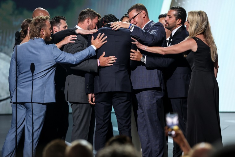 Damar Hamlin of the Buffalo Bills presents the Pat Tillman Award for Service to the trainers of the Bills at the ESPY awards in Los Angeles on Wednesday.