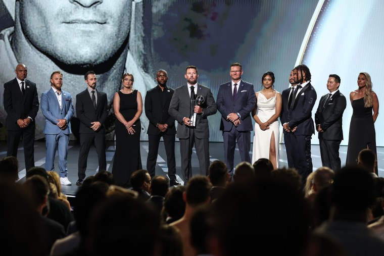 Damar Hamlin of the Buffalo Bills presents the Pat Tillman Award for Service to the trainers of the Bills at the ESPY awards in Los Angeles on Wednesday.