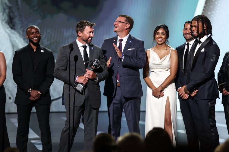 Damar Hamlin of the Buffalo Bills presents the Pat Tillman Award for Service to the trainers of the Bills at the ESPY awards in Los Angeles on Wednesday.