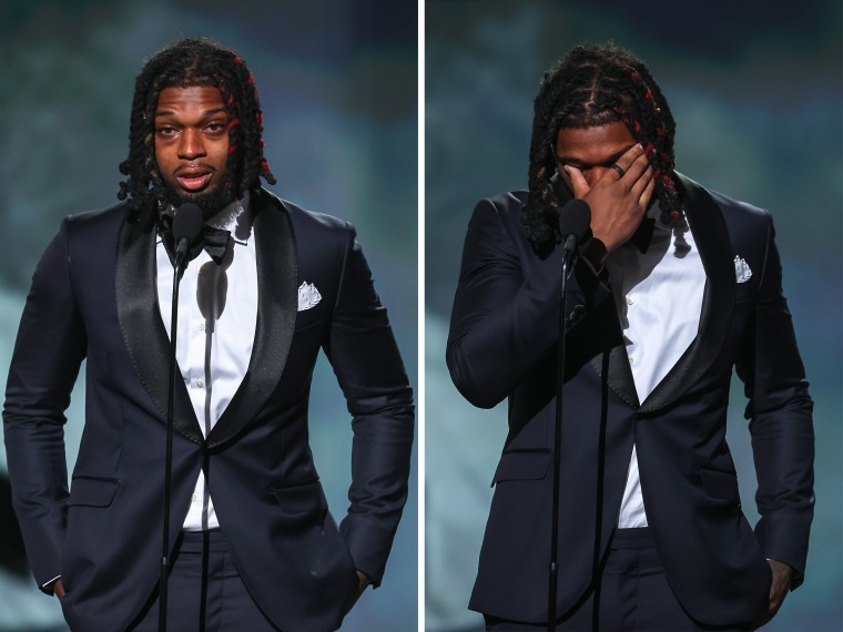 Damar Hamlin of the Buffalo Bills presents the Pat Tillman Award for Service to the trainers of the Bills at the ESPY awards in Los Angeles on Wednesday.