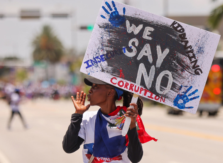A marcher during a Relief for Haiti rally, in Miami