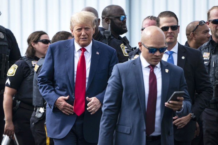 COLUMBUS, GA- JUNE 10: Former President Donald Trump and his aid Walt Nauta (right) arrive at an airport after Trump spoke at the Georgia Republican Party's state convention on Saturday, June 10, 2023 in Columbus, GA.  (Photo by Jabin Botsford/The Washington Post via Getty Images)