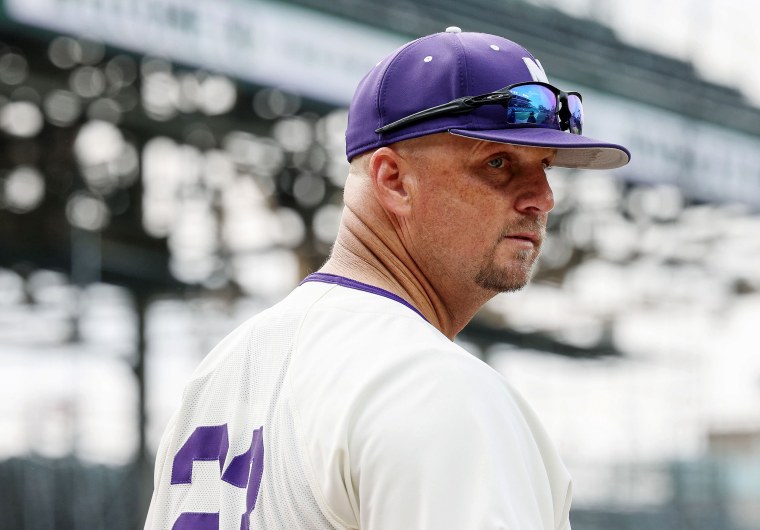 Northwestern University head baseball coach Jim Foster heads back to the dugout for a game against the University of Notre Dame at Wrigley Field in Chicago, on May 16, 2023.