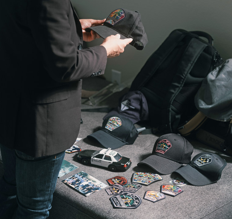 Christian Mendoza shows off some his police memorabilia.