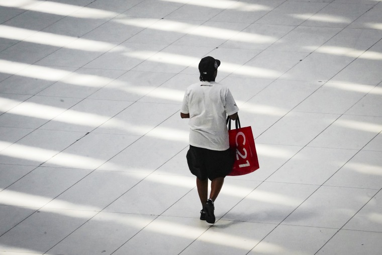 A shopper in a mall in New York on June 6, 2023.