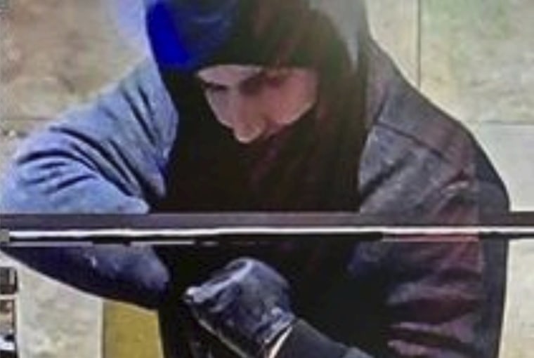 A man later identified as Caleb Rogers is seen on security cameras on Jan. 6, 2022, during a robbery at the Aliante hotel-casino in North Las Vegas.