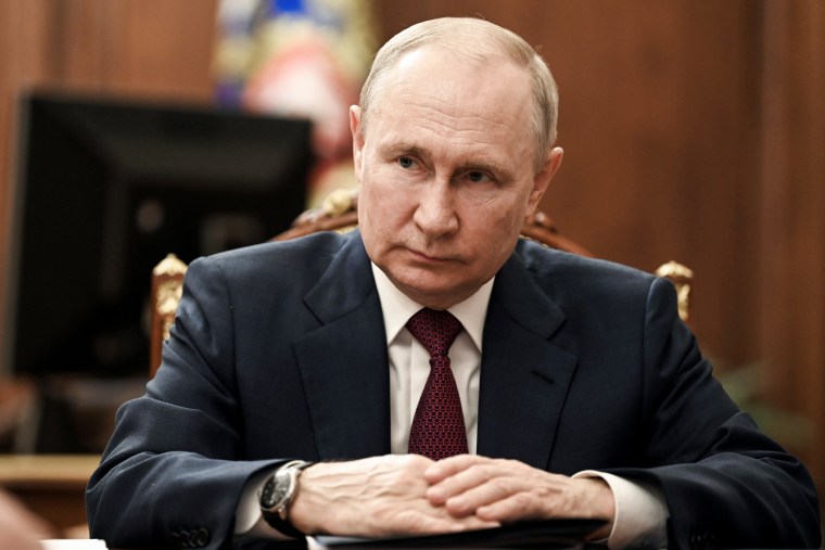 Russian President Vladimir Putin listens in Moscow on July 4, 2023.
