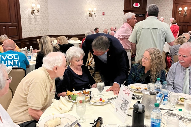 Sen. Joe Manchin, D-W.Va., speaks with attendees at an event in New Hampshire on July 17, 2023.