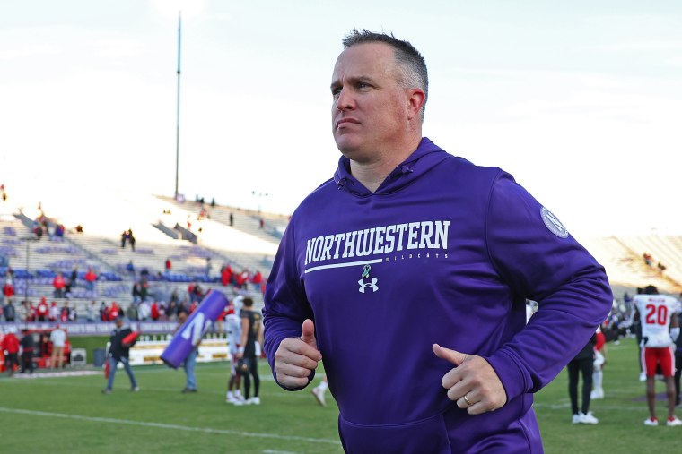 Pat Fitzgerald runs off the field during a game between the Northwestern Wildcats and Wisconsin Badgers in Evanston
