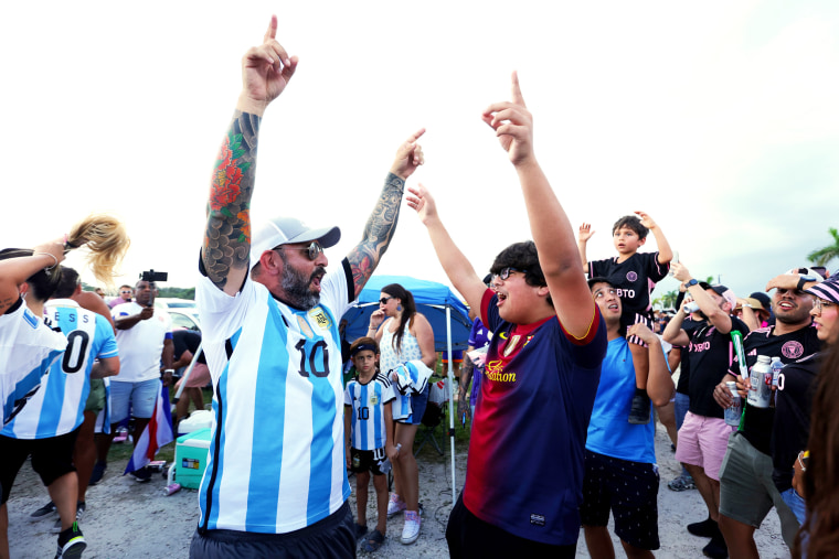 Fans cheer outside DRV PNK Stadium prior to the introduction of Lionel Messi with Inter Miami CF in Fort Lauderdale, Fla.