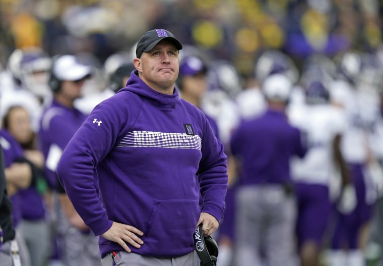 Northwestern coach Pat Fitzgerald stands on the sideline during a game in 2021.