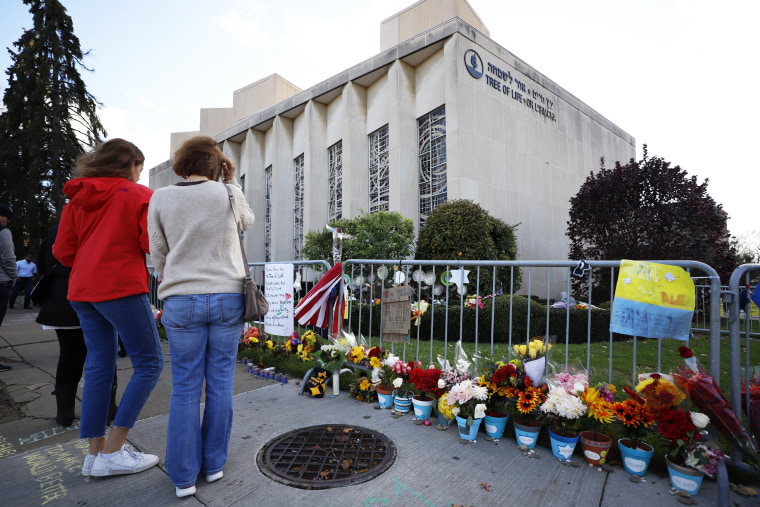 People look at a memorial outside the Tree of Life Synagogue in Pittsburgh